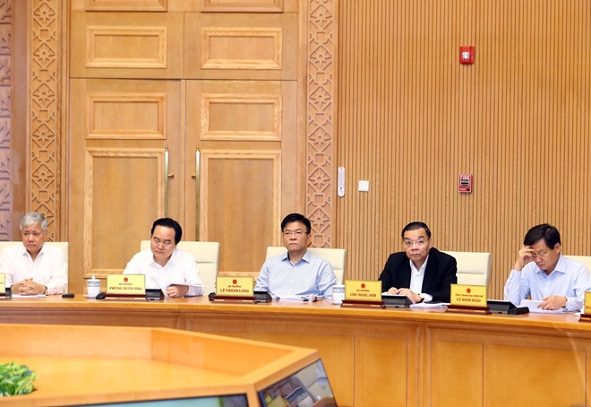 Th&agrave;nh vi&ecirc;n Ch&iacute;nh phủ tham dự phi&ecirc;n họp. (Ảnh: Thống Nhất/TTXVN)