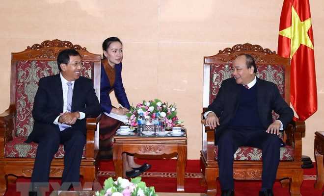 Thủ tướng đề nghị Ng&acirc;n h&agrave;ng Nh&agrave; nước Việt Nam tiếp tục hỗ trợ L&agrave;o