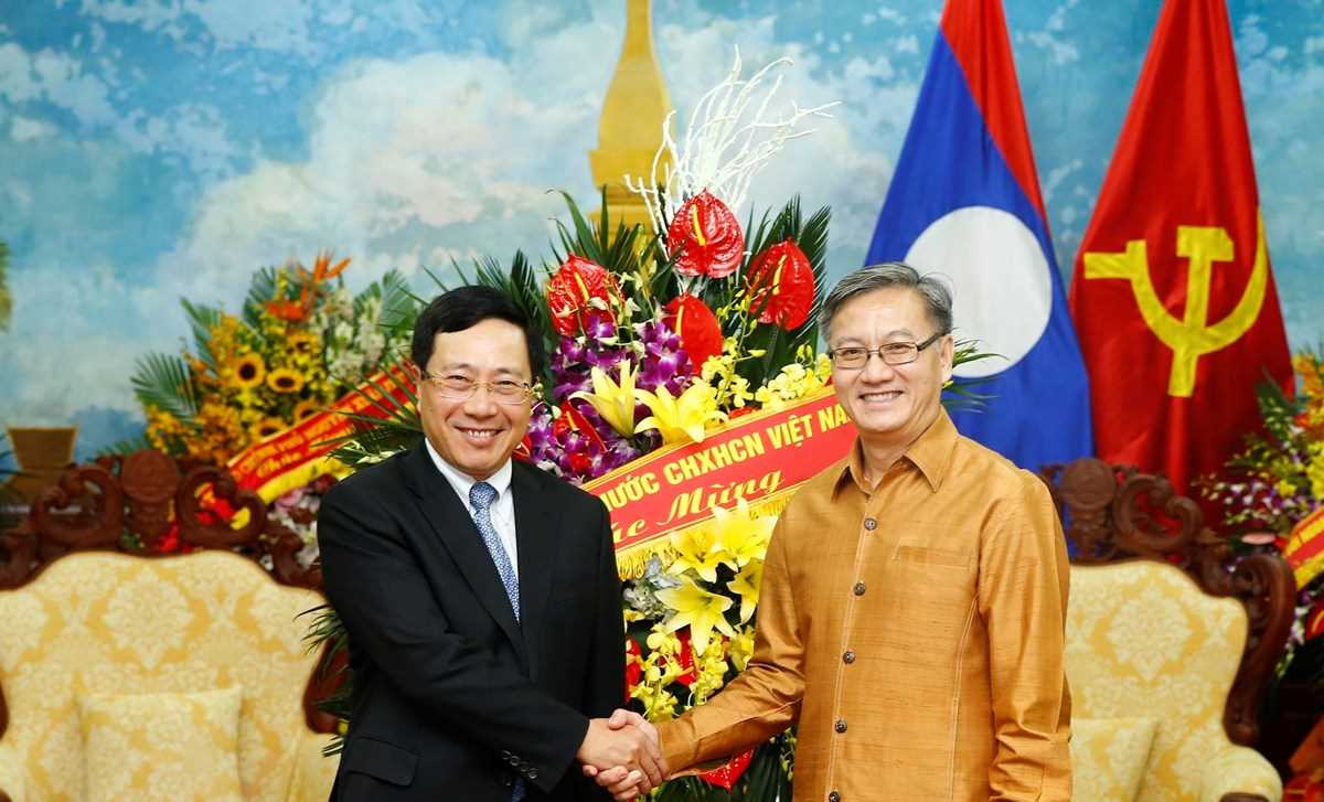 Ph&oacute; Thủ tướng Phạm B&igrave;nh Minh ch&uacute;c mừng Tết cổ truyền Bunpimay của L&agrave;o