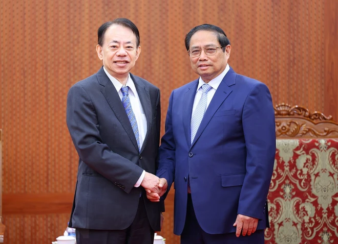Thủ tướng Phạm Minh Chính tiếp Chủ tịch ADB Masatsugu Asakawa. (Ảnh: Dương Giang-TTXVN) ttxvn_pham minh chinh masatsugu askawa.jpg