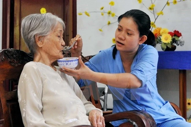 Chăm sóc đối tượng chính sách. (Nguồn: TTXVN) 2809 cong tac xa hoi.jpg